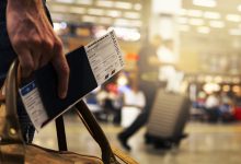 Man carrying tickets in hand