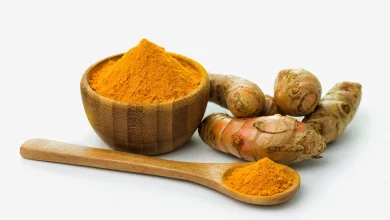 turmeric powder in a wooden bowl