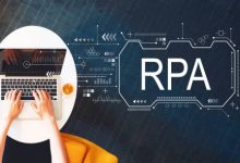 Robotic process automation concept with person using a laptop on a white table