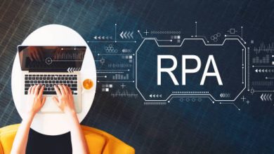 Robotic process automation concept with person using a laptop on a white table